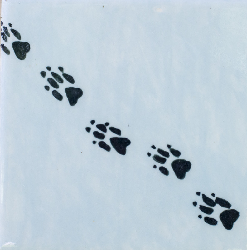 Painting of wolf prints in white snow.