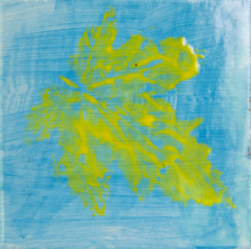 Painting of bright yellow leaf print with visible veins on a blue background.