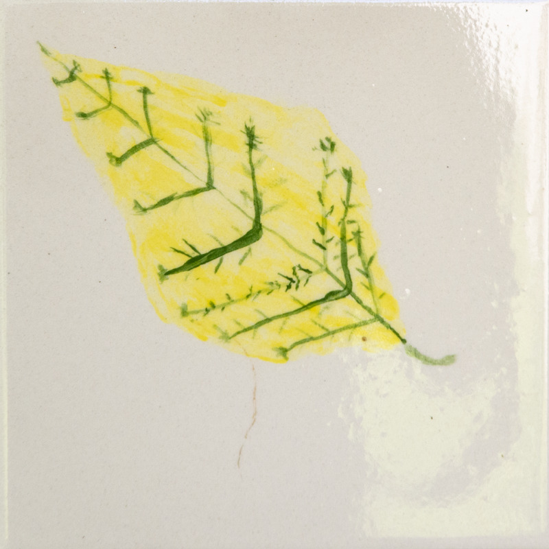 Painting of a yellow leaf with green veins.