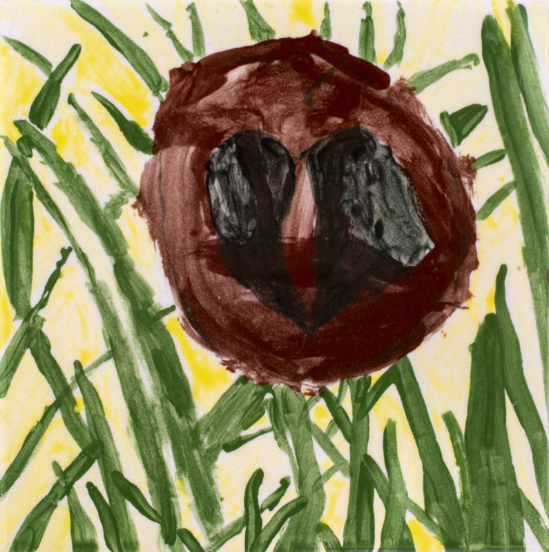 Painting of a walnut laying on the grass.