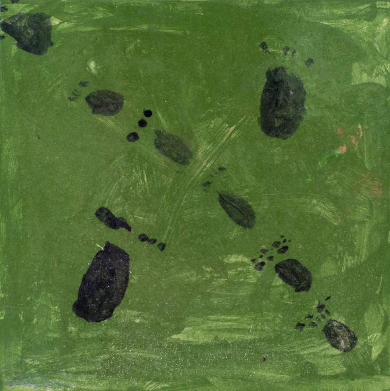 Painting of black animal footprints on the ground with a green background.