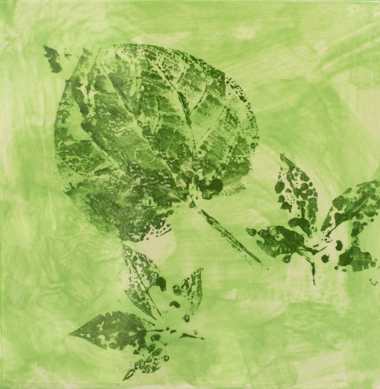 Prints of dark green leaves over a light green background.