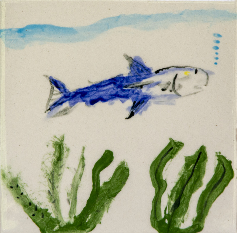 Painting of a blue fish swimming underwater, with green sea plants below.